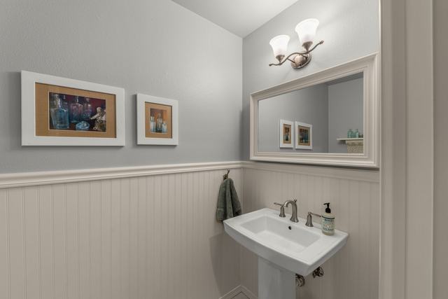 Half bath beside the media/flex room